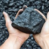 how organizational culture impacts companies. the image shows a lump of coal alluding to artisanal mining.